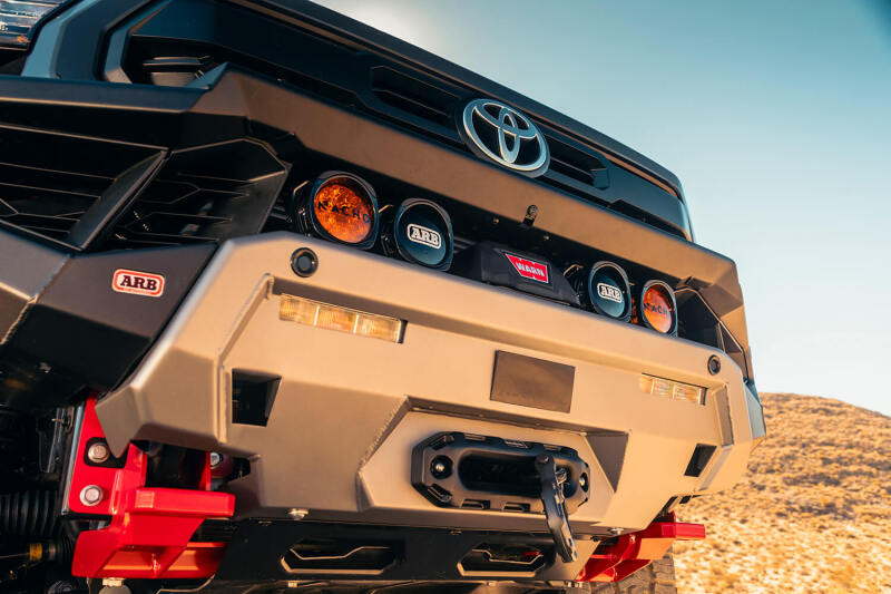 ARB 2024+ Toyota Tacoma Zenith winch bar in TXT black, durable bull bar with integrated winch mount on rugged off-road vehicle.