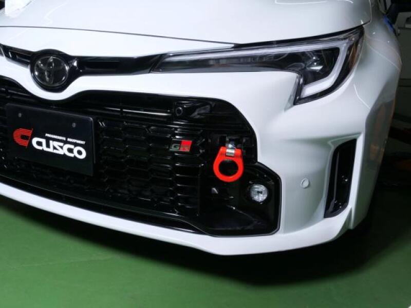 Cusco red steel folding tow hook for 2020+ Toyota GR Yaris GXPA16 GXPA12, showcasing durable automotive tow hook accessory.