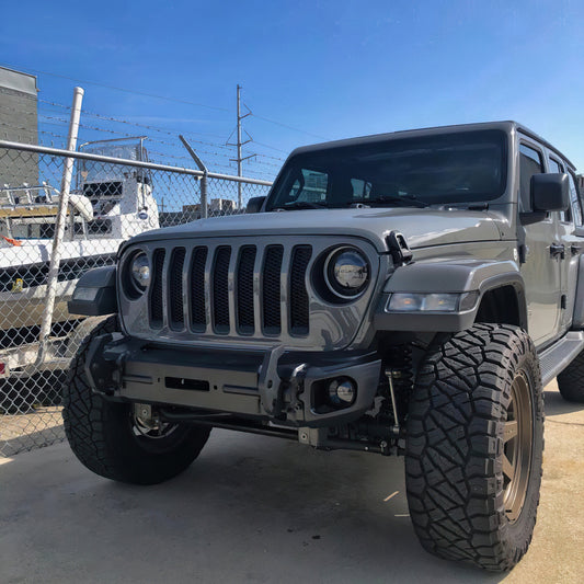 Oracle Lighting Jeep Wrangler JL and Gladiator JT sport high performance LED fog lights without halo installed on vehicle.