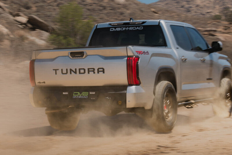 Steel rear bumper for Toyota Tundra, DV8 Offroad Spec Series, with rugged design and mounting points visible.