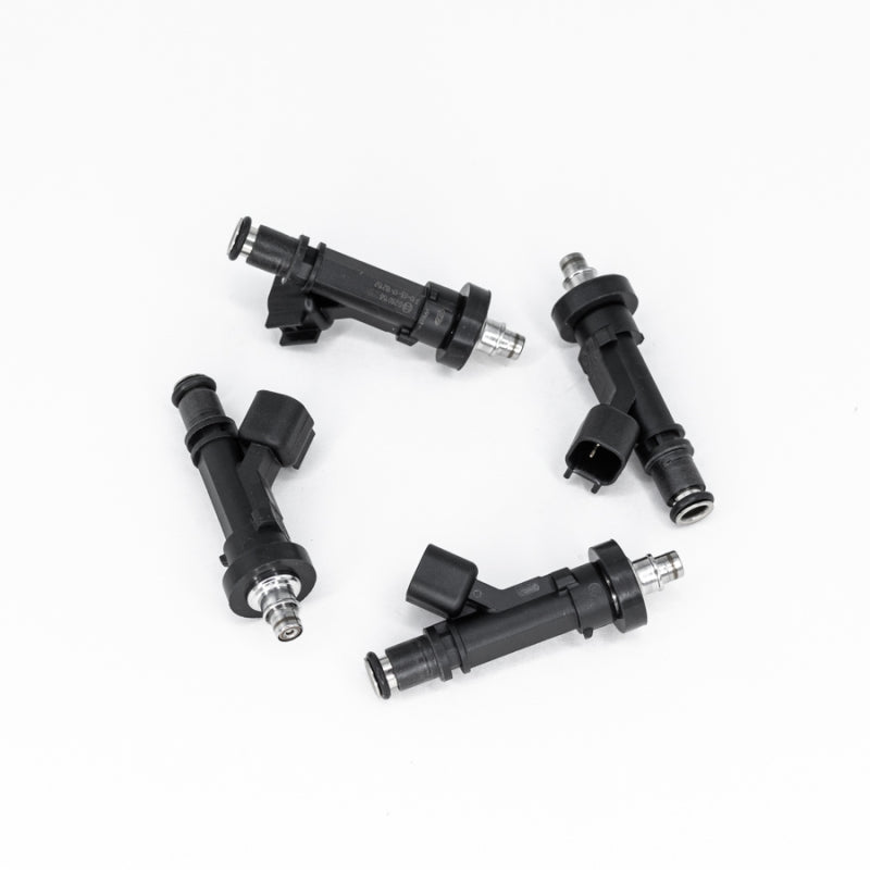 DeatschWerks set of 4 Acura Integra fuel injectors for 4-cylinder OBD I & II engines, replacement parts with metal connectors.