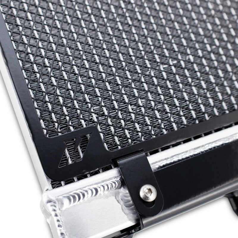 Mishimoto performance auxiliary radiator for BMW F8X M3 M4 models, showing the sleek aluminum core and mounting brackets.