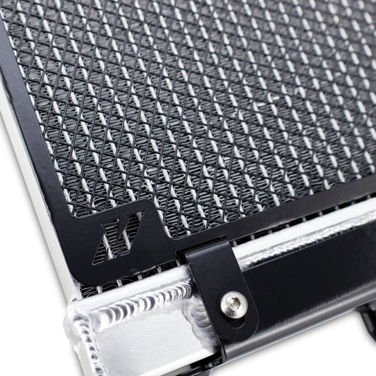 Mishimoto performance auxiliary radiator for BMW F8X M3 M4 models, showing the sleek aluminum core and mounting brackets.