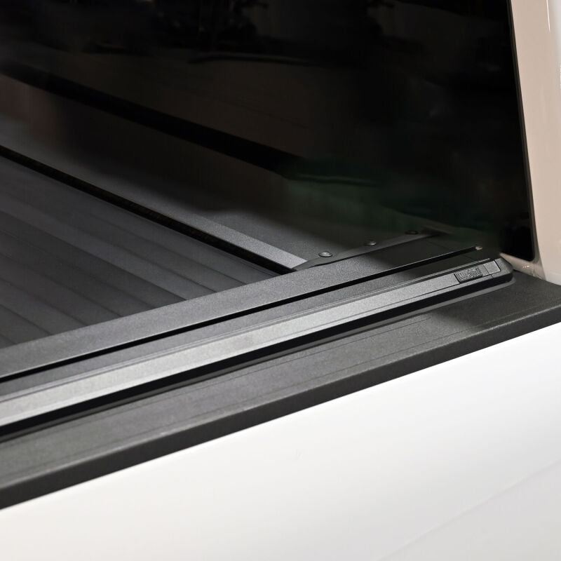 Westin black roll-up tonneau cover on 6ft 10in bed of Ford F-250/F-350/F-450/F-550 SD truck, manual retractable design.