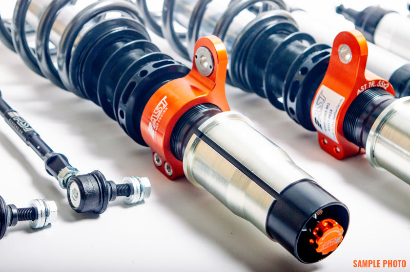 AST 5100 Series coilovers for BMW 1 Series E81/E82/E87/E88 rear suspension, featuring adjustable coilover shocks.