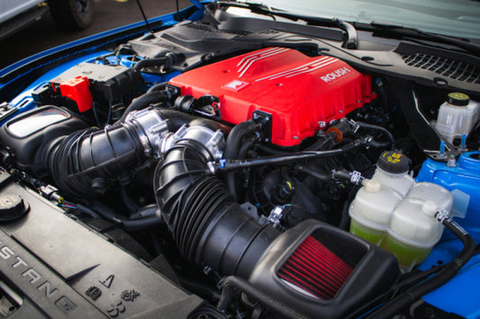 Roush 2026 Ford Mustang 5.0L supercharger kit with high-performance components for 810 HP engine upgrade.