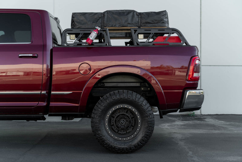 DV8 Offroad MTO Series bed rack for Toyota Tundra and Ford F150 Raptor, 2-piece adjustable exterior truck bed accessory.