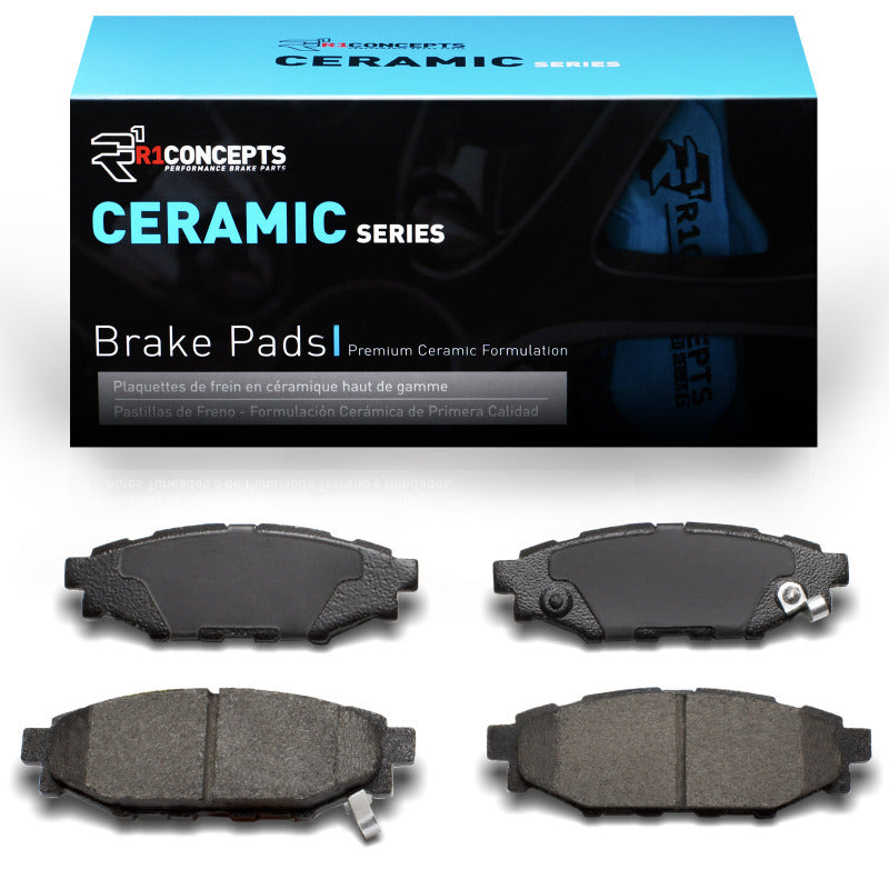 R1 Concepts Subaru Forester rear OE ceramic brake pads, showing the brake pad set with metal backing plates and friction material.