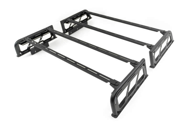 DV8 Offroad MTO Series bed rack for Toyota Tundra and Ford F150 Raptor, 2-piece adjustable truck bed accessory system.