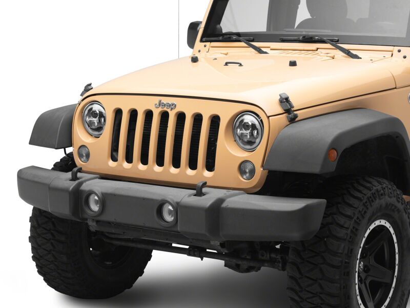 Raxiom 07-18 Jeep Wrangler LED headlights with black housing and clear lens, featuring daytime running lights and 7-inch size.