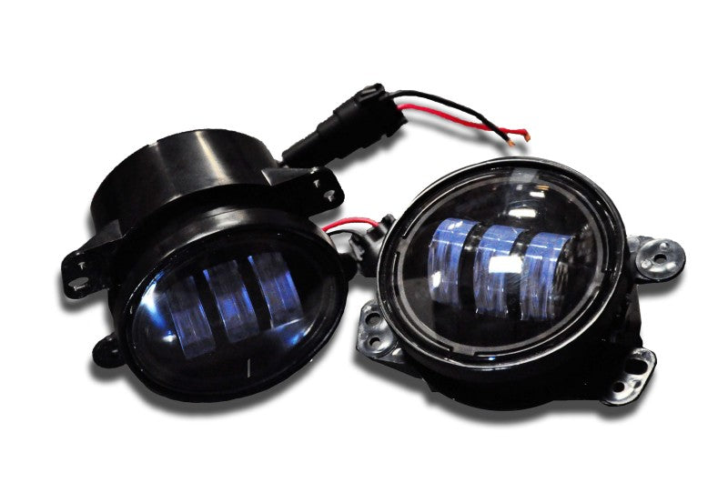 DV8 Offroad Jeep Wrangler JK 4-inch LED fog lights mounted on front bumper, bright 30W replacement fog lights for off-road vehicles.
