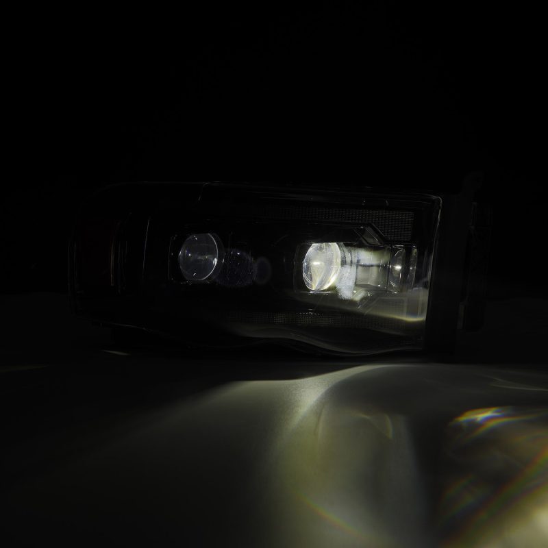 AlphaRex Dodge Ram 1500 PRO-Series projector headlights in black with sequential signal lights, plank style, for 2002-2005 models.