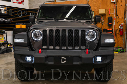 Diode Dynamics SS3 Type MS yellow LED fog light kit installed in vehicle, showing bright yellow fog lights for SAE compliance.