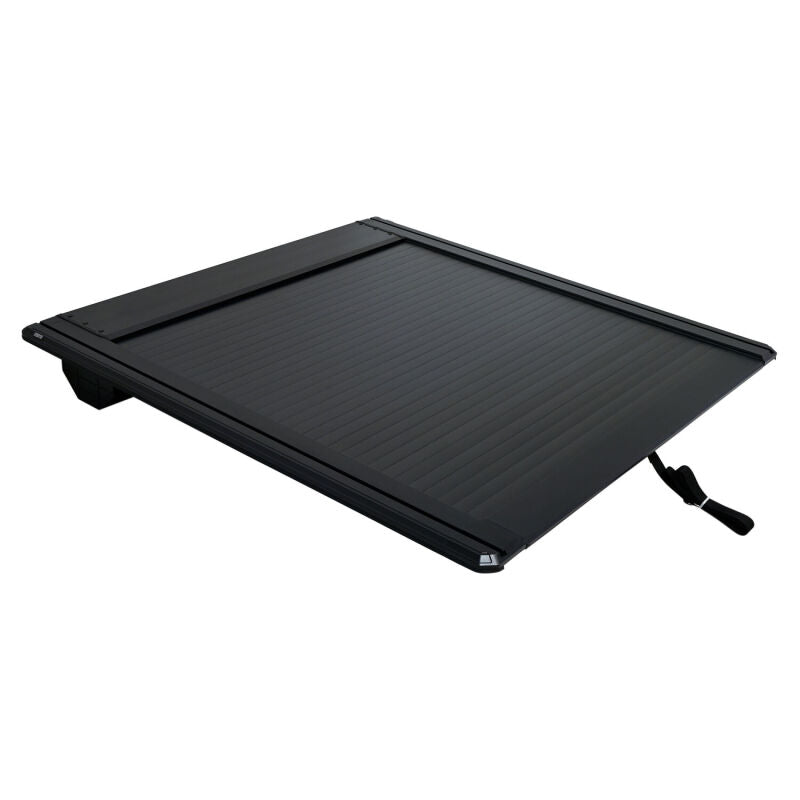 Black Westin roll-up tonneau cover installed on a Toyota Tacoma 5ft bed, providing secure, retractable truck bed protection.