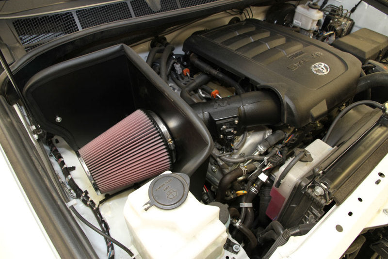 K&N Engineering cold air intake system installed in a 2014-2015 Toyota Tundra V8 4.7L/5.7L engine, showing the air filter and tubing.
