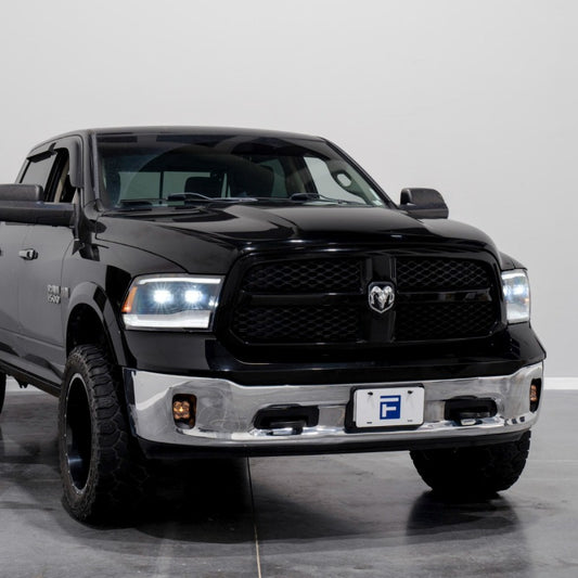 Pair of FORM Lighting sequential LED projector headlights for 2009-2018 Ram 1500, 2500, 3500 trucks, featuring modern LED design.