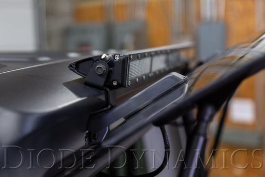 Diode Dynamics Jeep JL Wrangler SS30 rear hardtop bracket kit with white flood light mounts on a vehicle's hardtop.