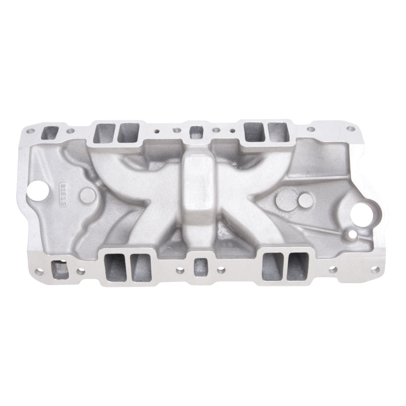 Edelbrock Performer EPS intake manifold for small-block Chevy with oil fill tube and breather, showing polished metal finish and mounting ports.