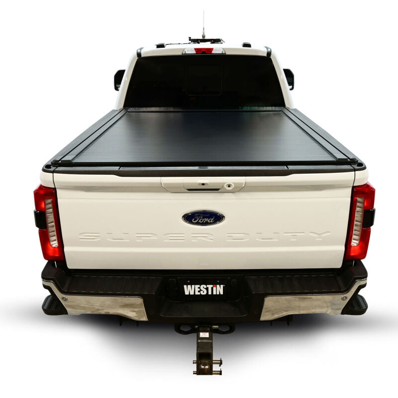 Westin roll-up tonneau cover in black installed on a Ford F-250/F-350/F-450/F-550 SD with a 6ft 10in bed
