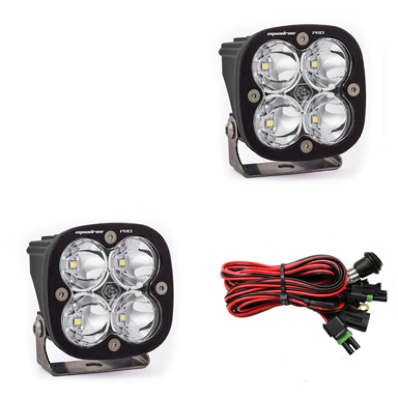 Baja Designs Squadron Pro Series LED light pods with spot pattern mounted on a vehicle for off-road illumination.