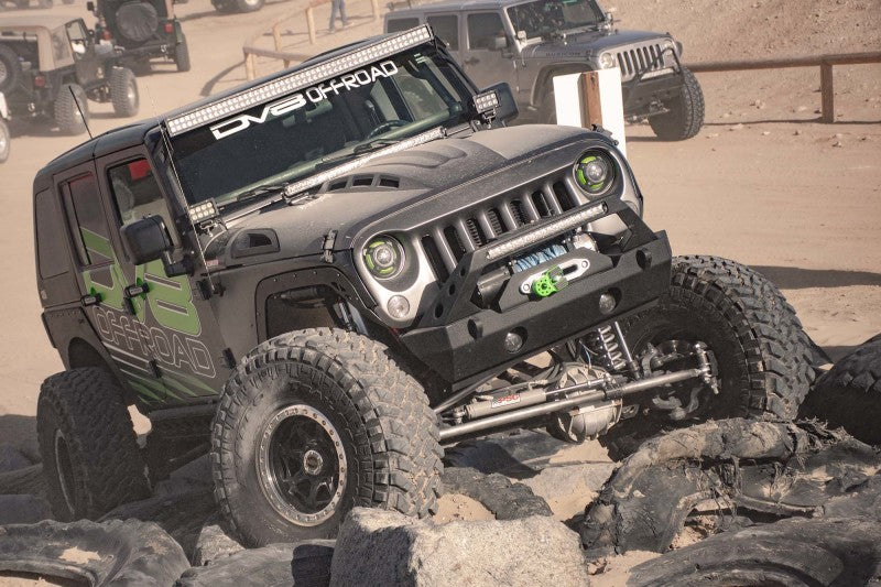 Black primer DV8 Offroad metal heat dispersion hood for Jeep Wrangler JK 2007-2018 with a rugged, durable design.