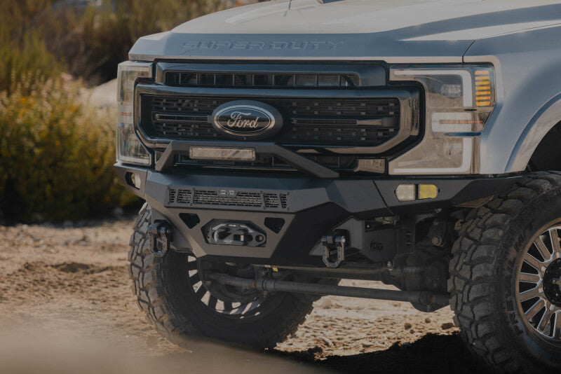 DV8 Offroad steel front bumper for Ford Super Duty F-250/F-350 (2017-2022) with rugged design and heavy-duty construction.
