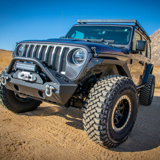 DV8 Offroad 18-21 Jeep Wrangler JL 4-Door roof rack shown installed on vehicle for extra cargo space and off-road gear transport.