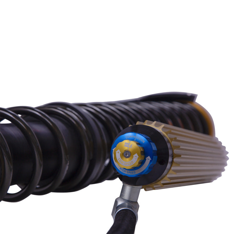 Bilstein coilovers with black shock and coil spring assembly for Can-Am Maverick X3 Max RS Turbo off-road vehicle.
