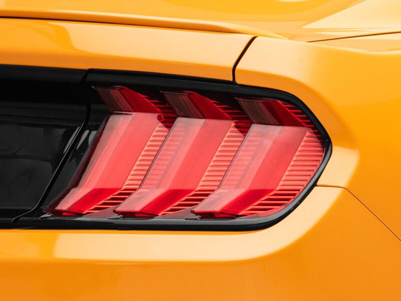 Raxiom Ford Mustang Euro Style LED tail lights with gloss black housing and red lens, designed for 2015-2023 models.