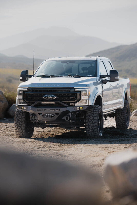 Steel front bumper for Ford Super Duty F-250/F-350 by DV8 Offroad, part of the Spec Series, rugged and heavy-duty design