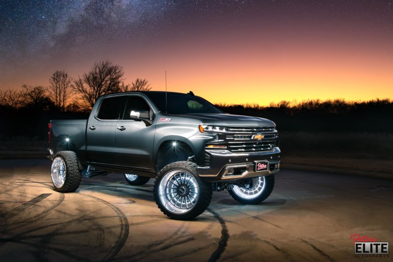 Oracle Lighting LED illuminated wheel rings with ColorSHIFT no remote, showcasing vibrant multi-color light strip on car wheels.