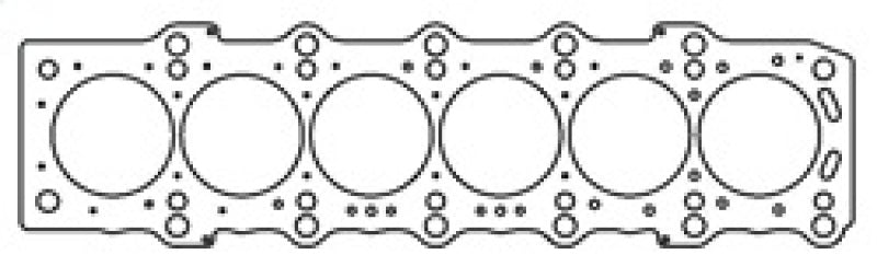 Cometic Toyota 2JZGE/2JZGTE MLS head gasket with 87mm bore and .092 inch thickness, shown in a close-up view of the gasket.