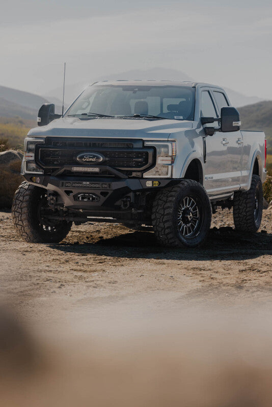 Steel front bumper for Ford Super Duty F-250/F-350 by DV8 Offroad, part of the Spec Series, designed for heavy-duty off-road use.
