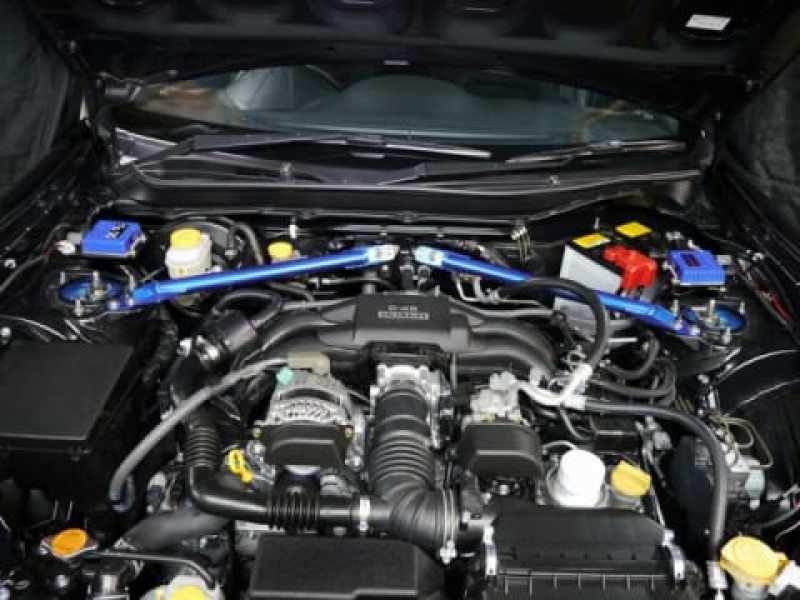 Cusco PowerBrace strut support for Subaru BRZ, Toyota 86, Scion FR-S, showing 35mm OD chassis bracing connected to firewall.