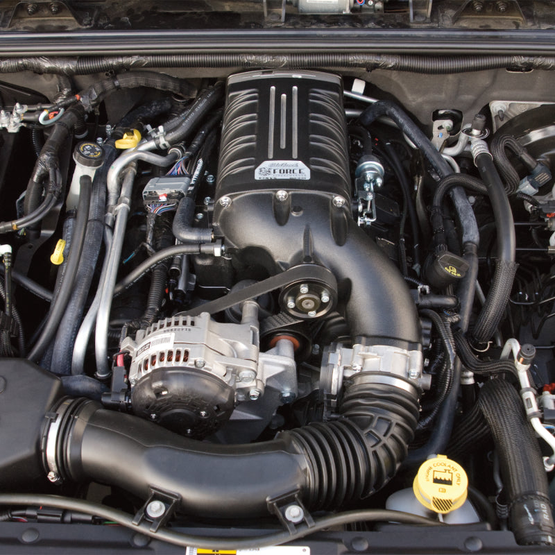 Edelbrock Supercharger Stage 1 Street Kit for 2012-2014 Jeep Wrangler 3.6L V6 engine, with visible supercharger components and mounting hardware.