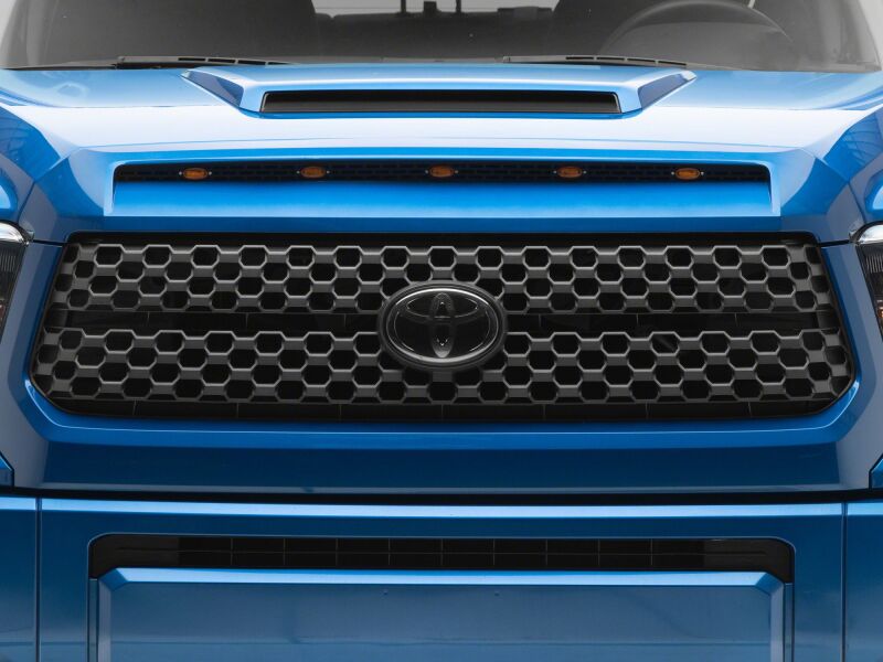 Raxiom 14-21 Toyota Tundra 5-LED grille light accessory installed on front grille for enhanced visibility and style.