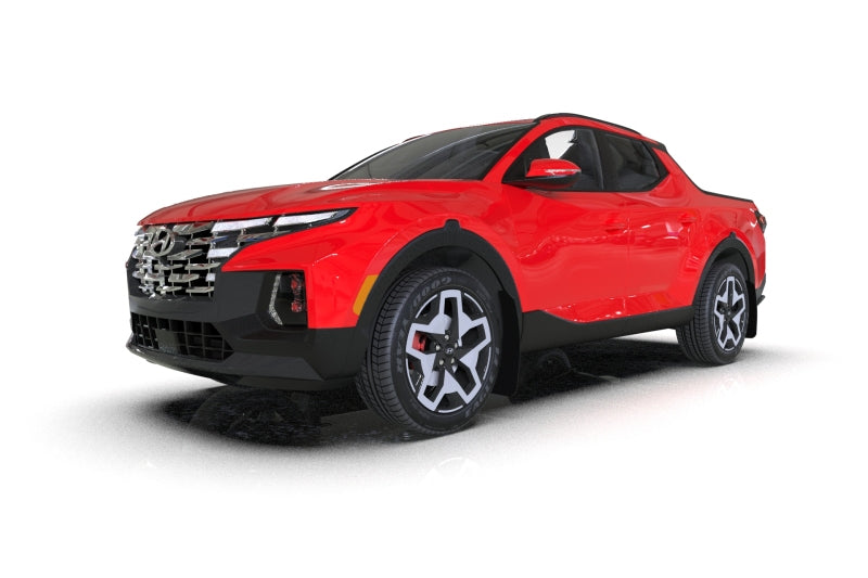 Rally Armor black mud flaps with grey logo for Hyundai Santa Cruz, 22-26 model, showing close-up of the mud flap attached to vehicle.