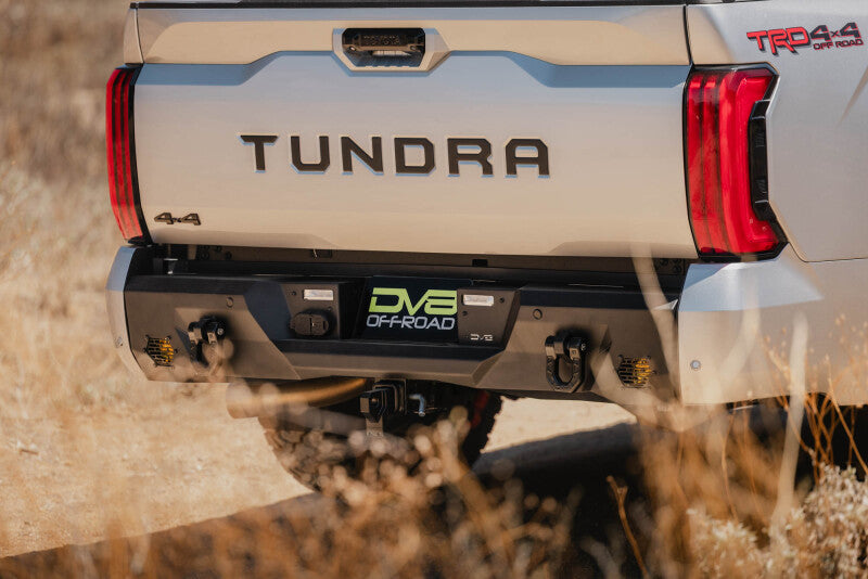 Steel rear bumper for Toyota Tundra DV8 Offroad Spec Series, rugged design with mounting points visible.