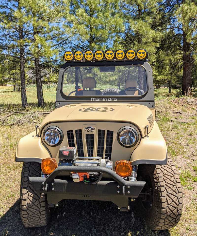 Yellow and black KC HiLiTES 6-inch hard cover with a smiley face logo for Gravity Pro6 LED lights, designed as a protective light cover.