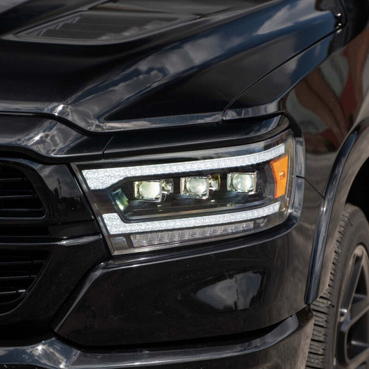 Pair of FORM Lighting Ram 1500 sequential LED projector headlights showing sleek design and bright illumination
