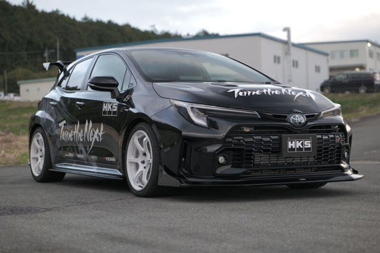 HKS body kit TYPE-S GR Corolla side skirt installed on a car, showcasing sleek design and aerodynamic side panel details.