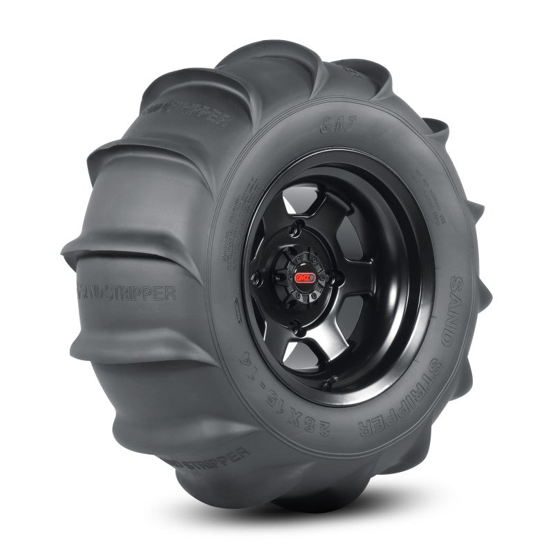 GMZ Race Products rear HP sand stripper tire with 14 paddles, 1-1/8 inch height, mounted on off-road UTV vehicle.