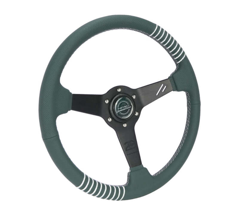 NRG black perforated leather steering wheel with emerald stitching, 350mm diameter, 1.5-inch dish, reinforced spoke design.