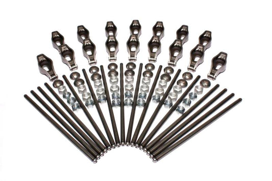 COMP Cams Magnum rocker arm and pushrod kit showing metal rocker arms and pushrods for high-performance engine upgrade.