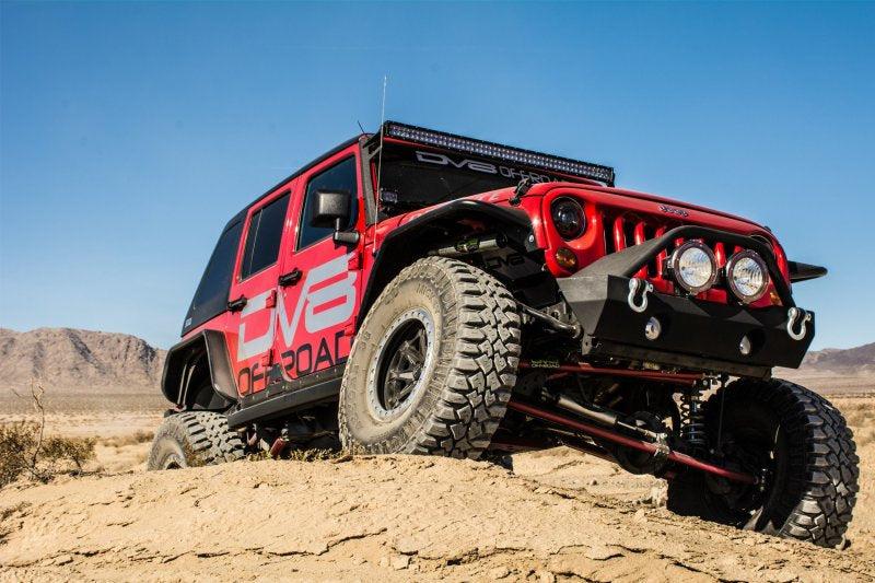 DV8 Offroad Jeep Wrangler JK flat tube front and rear fenders, black metal with rugged, off-road design, mounted on a Jeep.