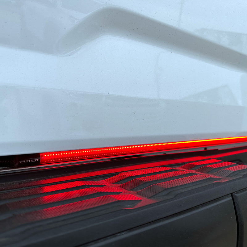 Putco 2024+ Ford F150 tailgate light bar with factory LED tail lights and 60-inch blade tailgate light bar, plug-and-play installation.