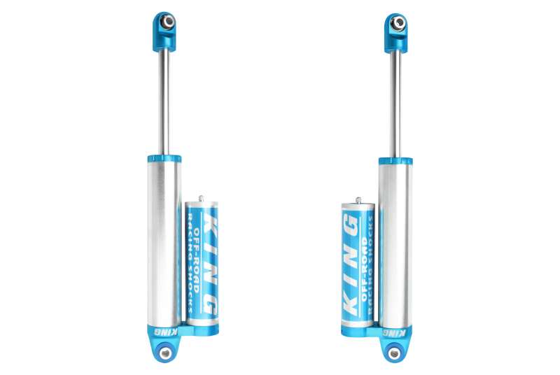 Pair of King Shocks 14+ Ram 3500 4WD rear 2.5-inch diameter piggyback reservoir shocks for heavy-duty truck suspension.