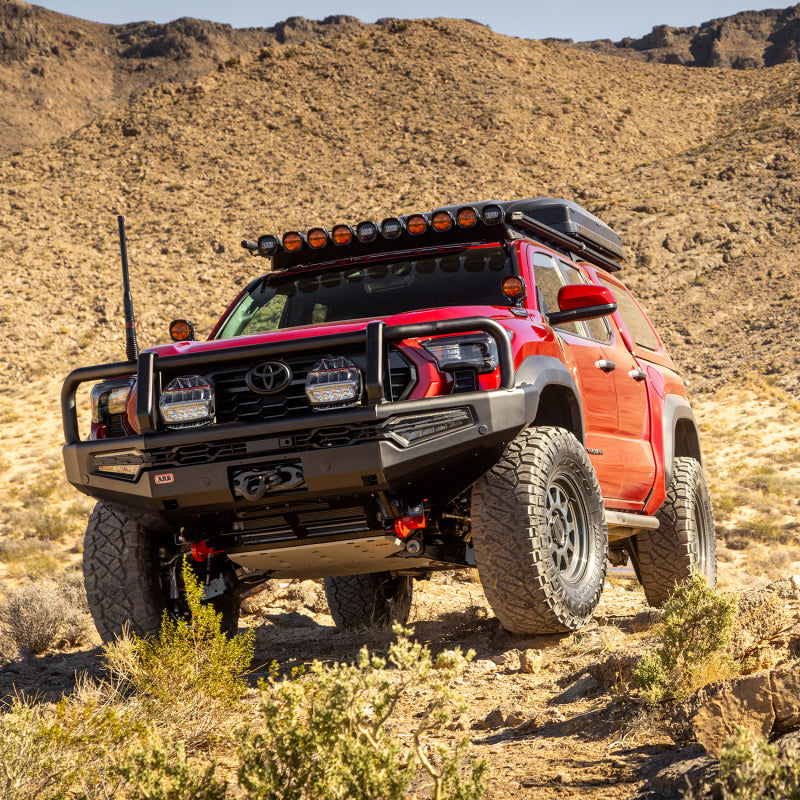 ARB Summit MKII Combar Bull Bar for Toyota Tacoma 2024+ with winch bumper, rugged metal construction, and mounting points visible.