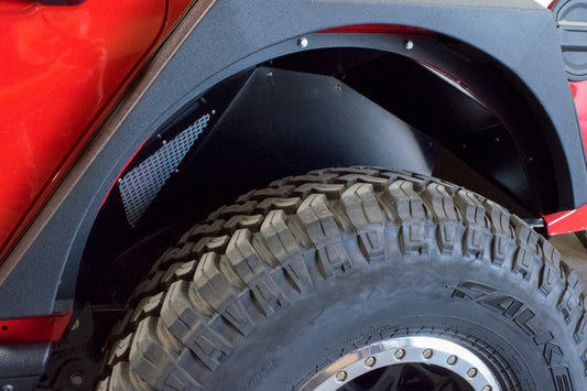 Black DV8 Offroad rear inner fenders for 2018+ Jeep Wrangler JL wheel well liners, showcasing durable offroad protection.