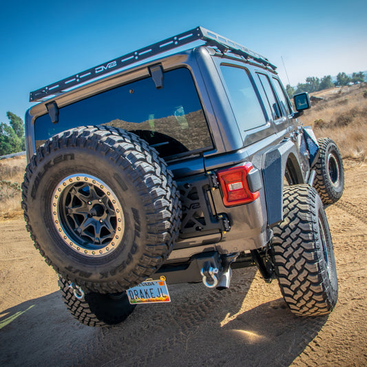 DV8 Offroad 18-21 Jeep Wrangler JL 4-Door roof rack mounted on vehicle for cargo and equipment storage.